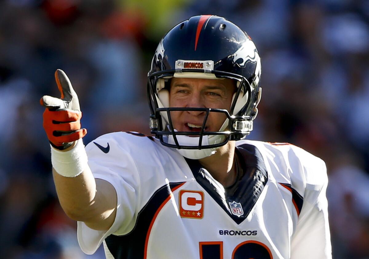 Denver Broncos quarterback Peyton Manning signals to a receiver before a play against the Chargers on Dec. 14 in San Diego.