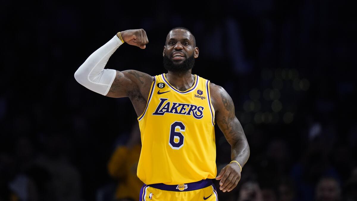 Lakers star LeBron James flexes his arm during his 48-point game against the Houston Rockets on Monday.