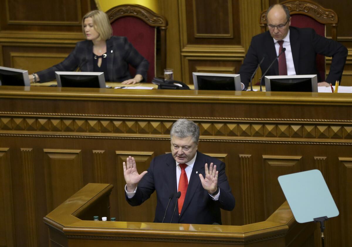 Ukrainian President Petro Poroshenko speaks to parliament in Kiev on Monday before a vote to impose martial law.