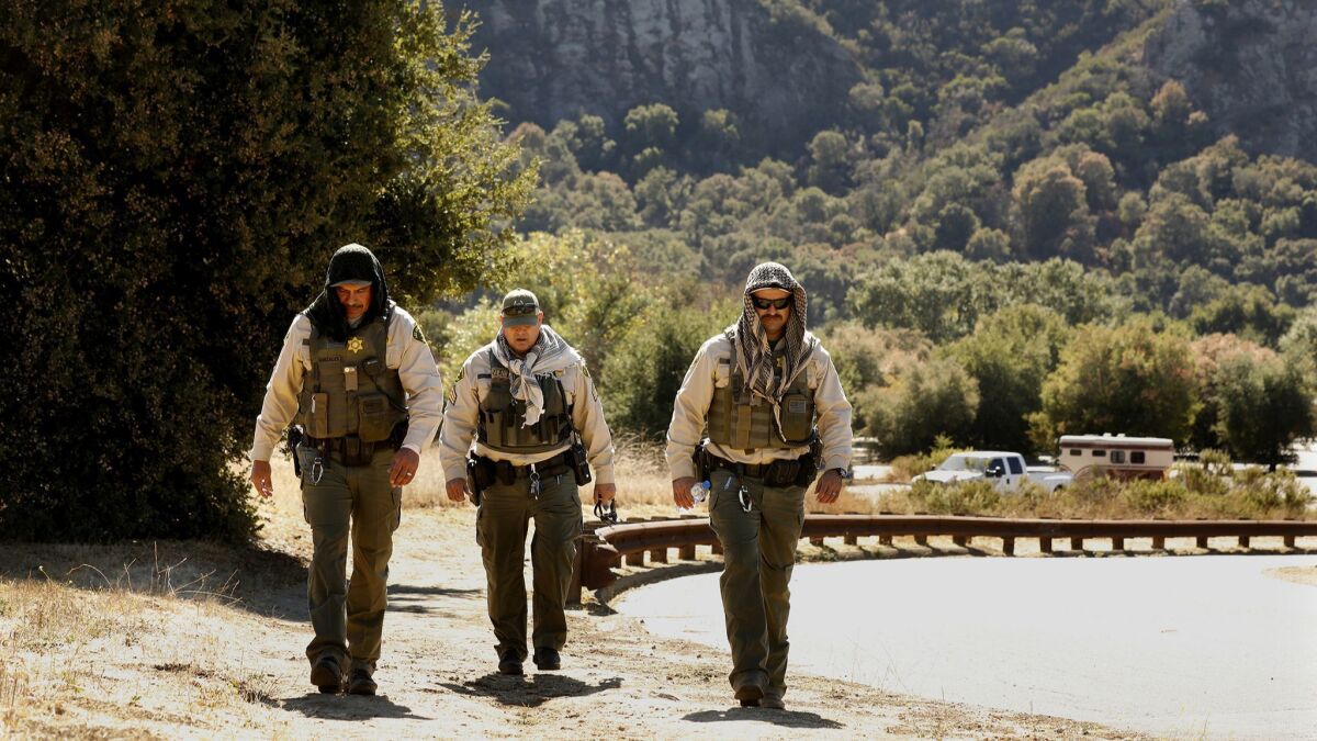Members of the Los Angeles County Sheriff's Department search Malibu Creek State Park in connection with the arrest of Anthony Rauda on Oct. 10.