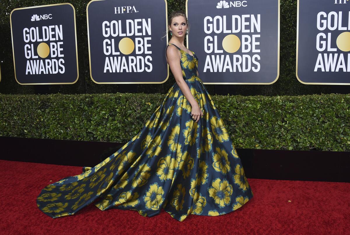 Taylor Swift arrives at the 77th Golden Globe Awards.