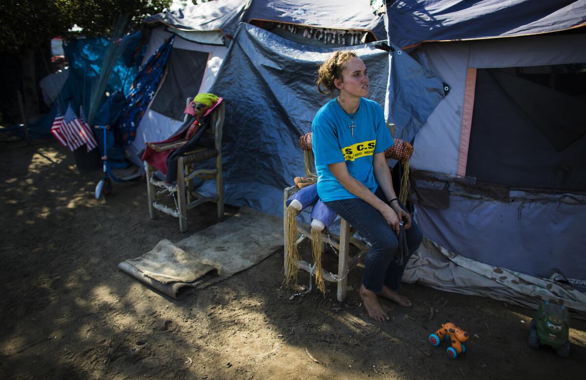 Ashley Foster, 23, has been living in the homeless encampment next to the Santa Ana River for three years.