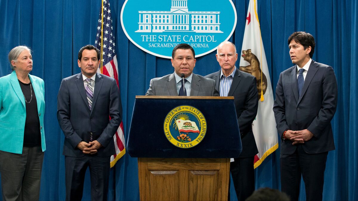 California Democrats, including then-Sen. Fran Pavley, Assembly Speaker Anthony Rendon, Assemblyman Eduardo Garcia, Gov. Jerry Brown and Senate leader Kevin de León, speak at a news conference last year after approving new climate policies.