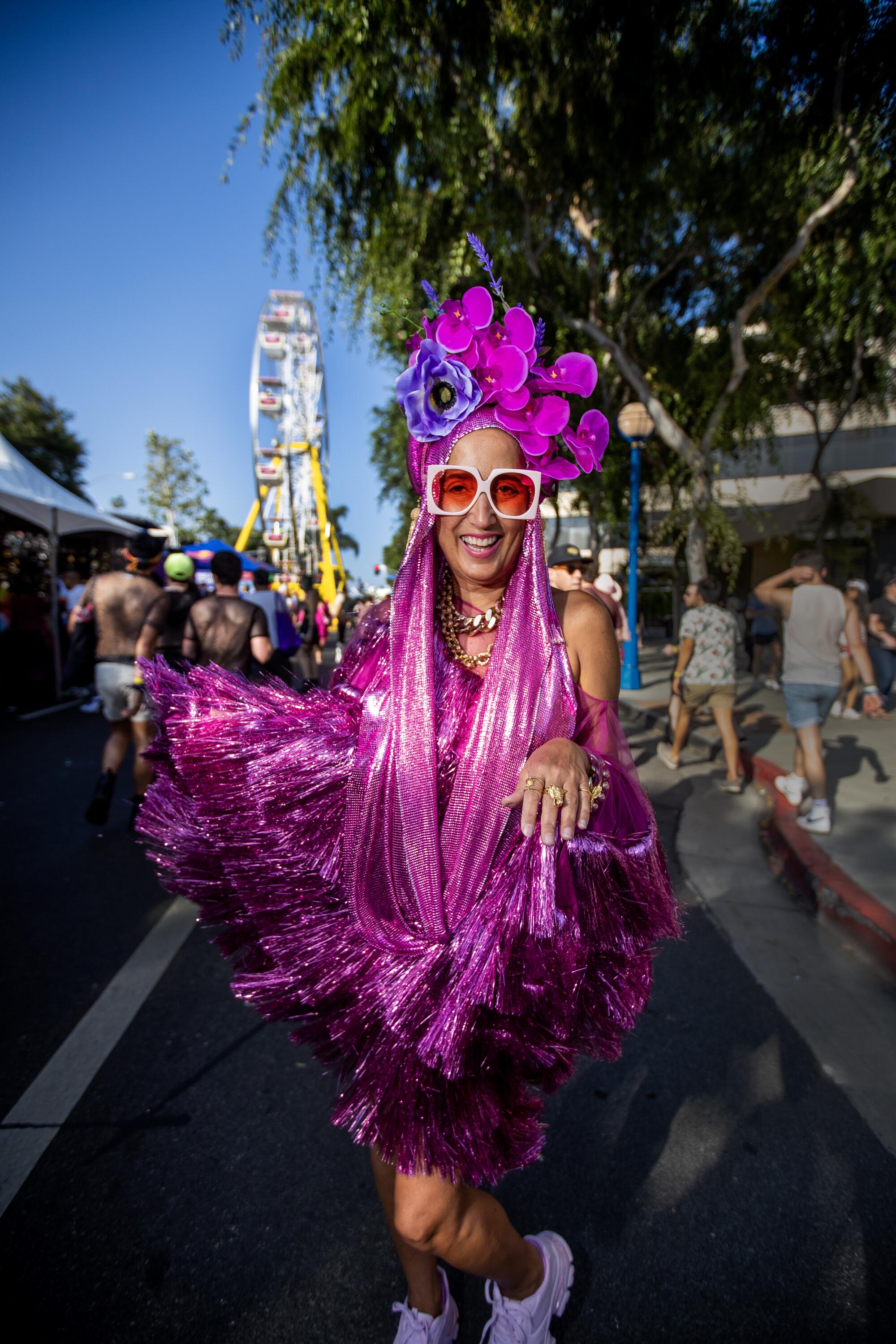 Julia Clancey, who made her own outfit, poses while celebrating at the WeHo Pride Festival.