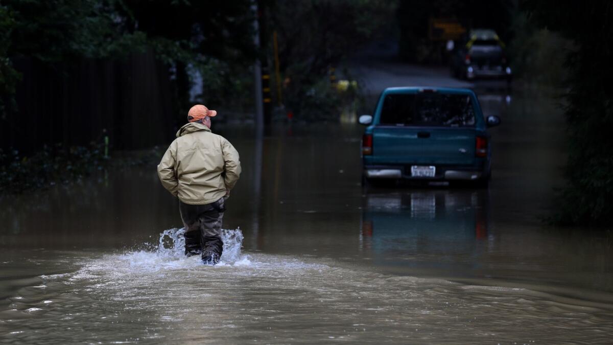 A storm brought flooding Feb. 15 to Guerneville, Calif. Another storm is expected to unleash rain and snow in Northern California this week.
