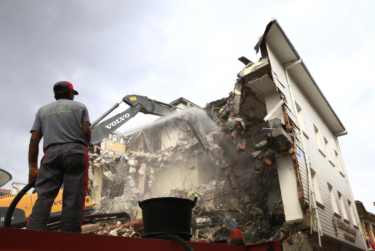 Workers in Istanbul demolish the Halit Pasa Residence hotel on July 20, 2016. According to the state-run Anadolu news agency, the hotel was allegedly the meeting point of the plotters who planned the failed July 15 coup.