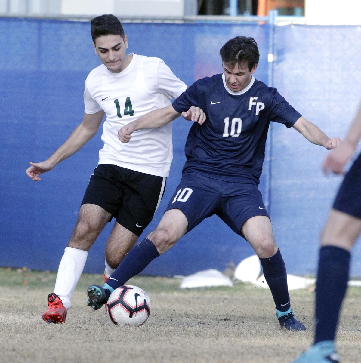 Flintridge Prep's Nick Klatsky gets control of the ball under pressure from Providence's Joseph Hamzoian during Wednesday's Prep League match.