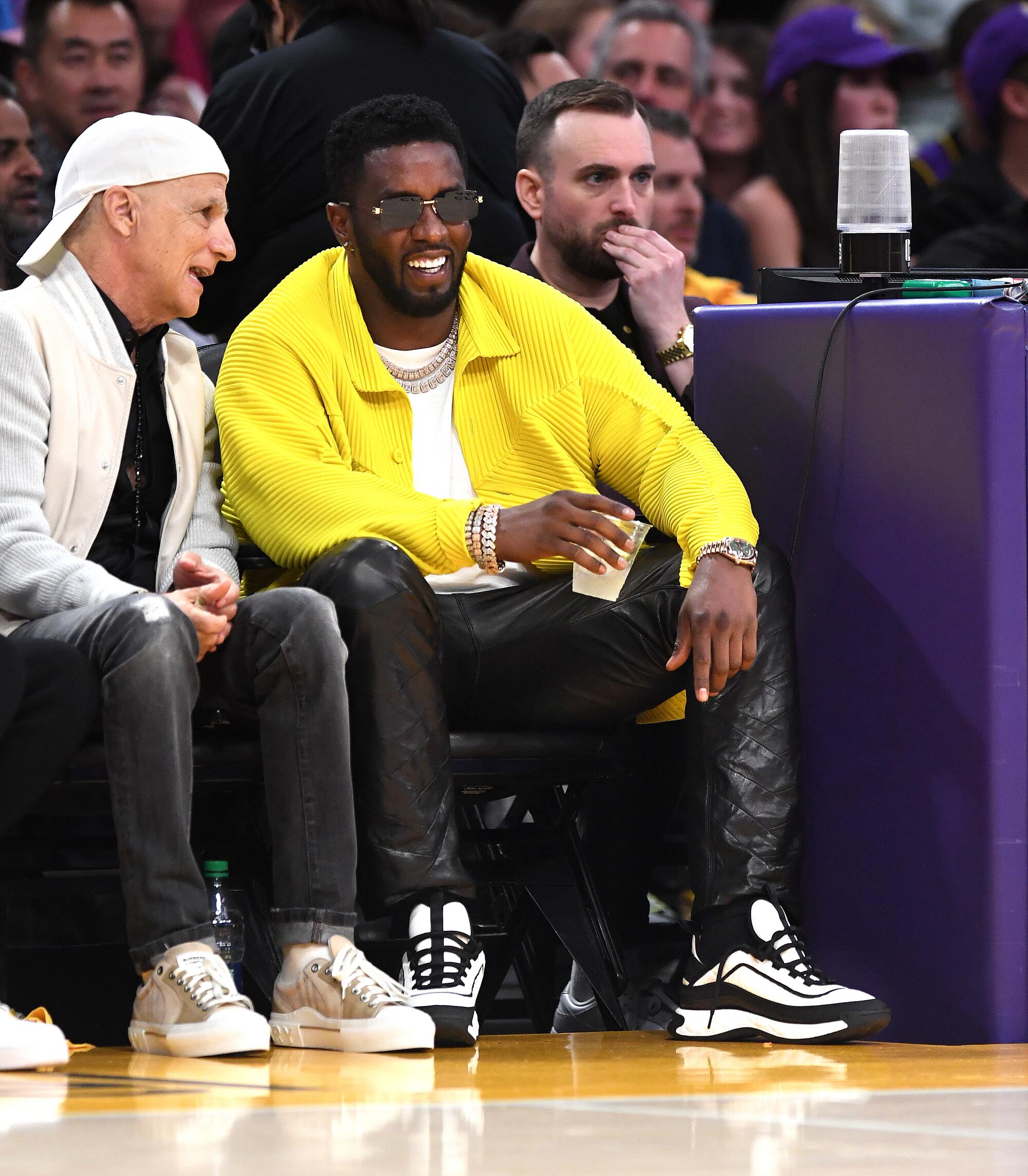 Rapper Sean 'Diddy' Combs attends a basketball game.