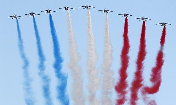 The Patrouille de France demonstration team of the French air force flies above the Champs Elysee during the Bastille Day military parade in Paris.