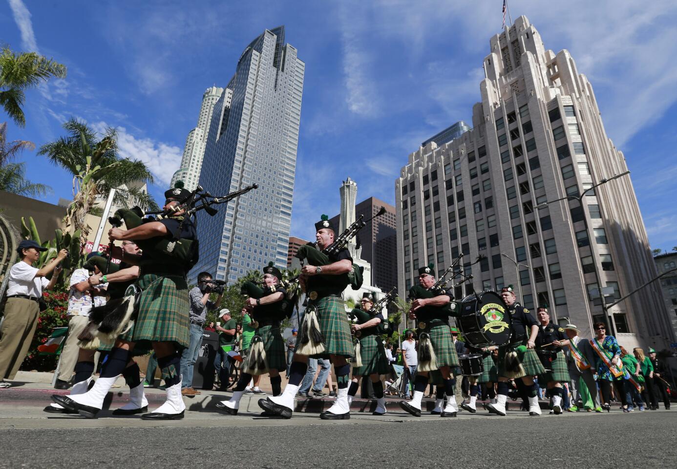 Members of the L.A. Police Emerald Society's Pipes and Drums Band march in the St. Patrick's Day parade in downtown Los Angeles.