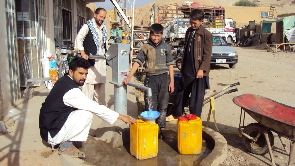 This 2012 photo shows hand pump mechanics who have been trained through USAID’s Afghan Sustainable Water Supply and Sanitation Project. They are paid by community contributions for the maintenance of wells. (Tetra Tech)
