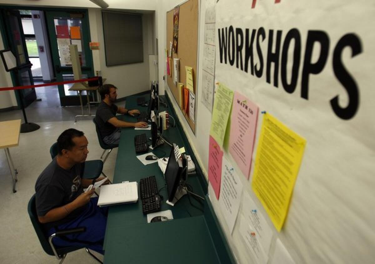 Students do math homework at Long Beach City College in a 2010 file photo. College officials are seeking to participate in a pilot project that would allow community colleges to charge all students non-resident tuition for high-demand classes such as algebra during summer and winter terms.