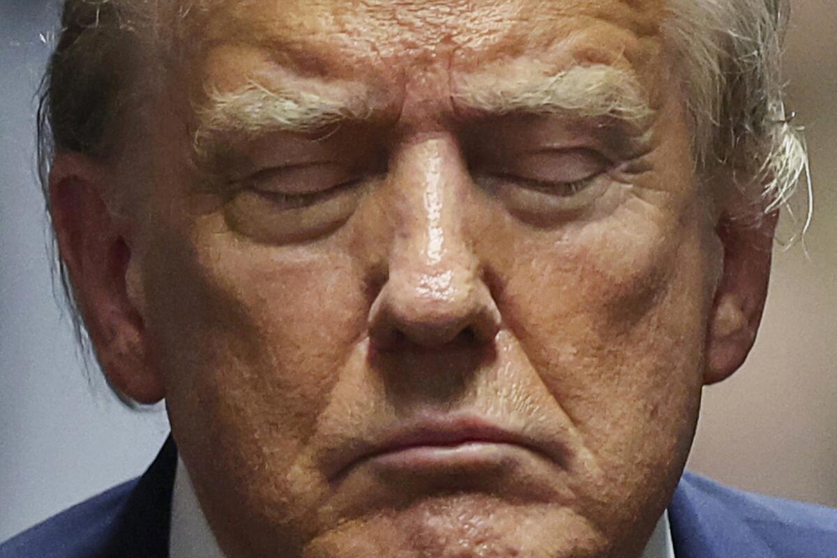 Former President Trump closes his eyes during his trial at Manhattan criminal court.