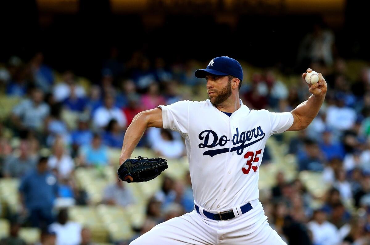 Dodgers starter Chris Capuano delivers a pitch during the team's 16-1 loss to the Philadelphia Phillies on Friday at Dodger Stadium.
