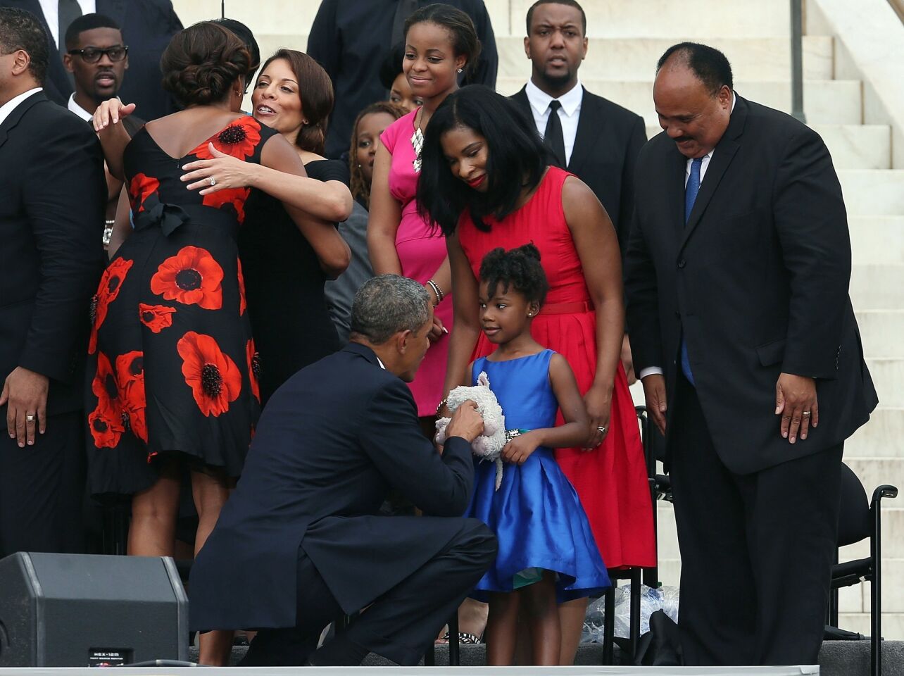 President Obama greets Yolanda King, daughter of Martin Luther King III, who looks on alongside his wife, Andrea King.