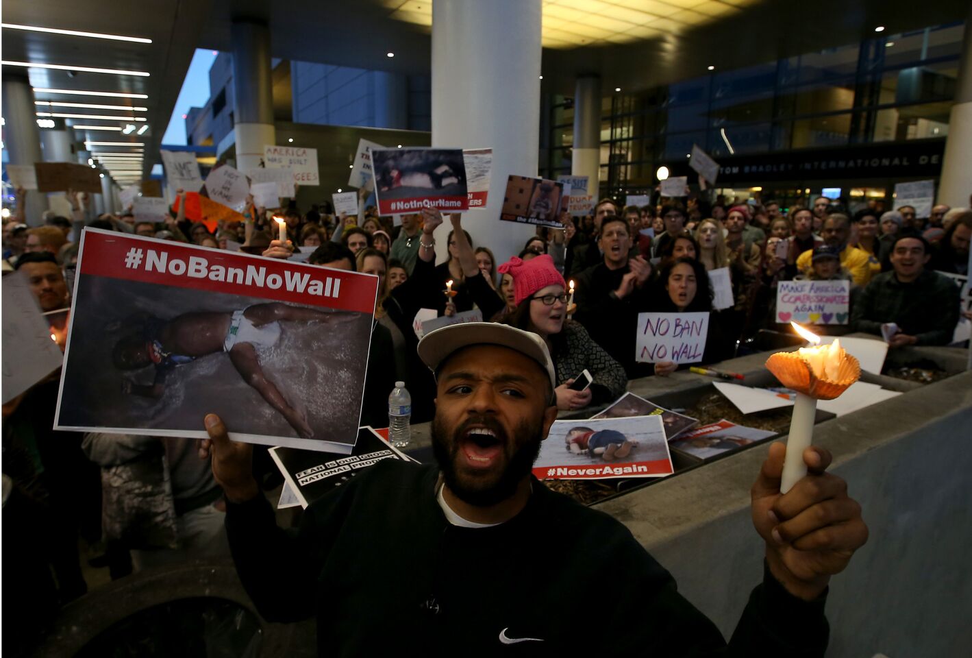Protesters rally against the new immigration order at Tom Bradley International Terminal at LAX.