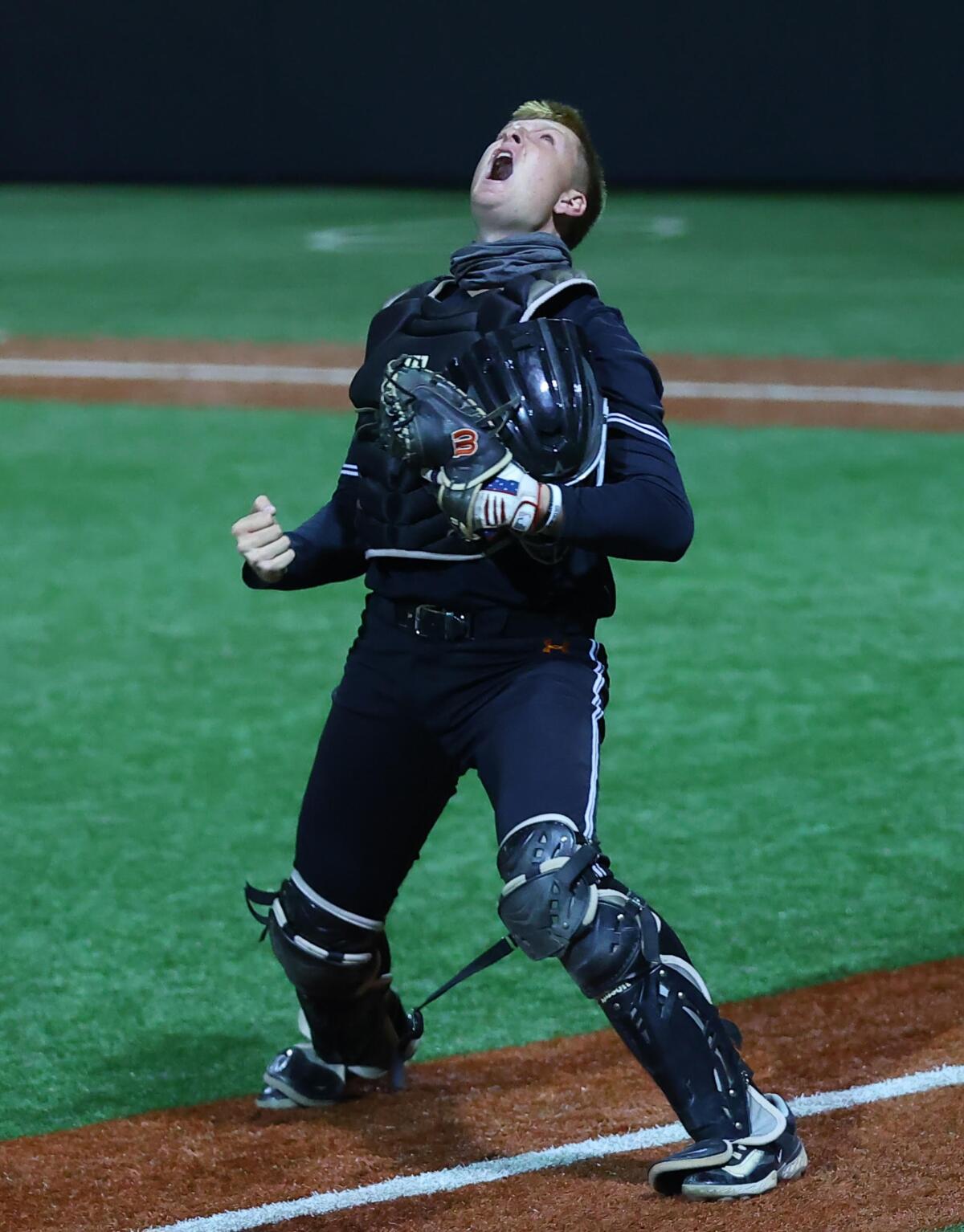 Catcher Trent Grindlinger of Huntington Beach lets out a yell.