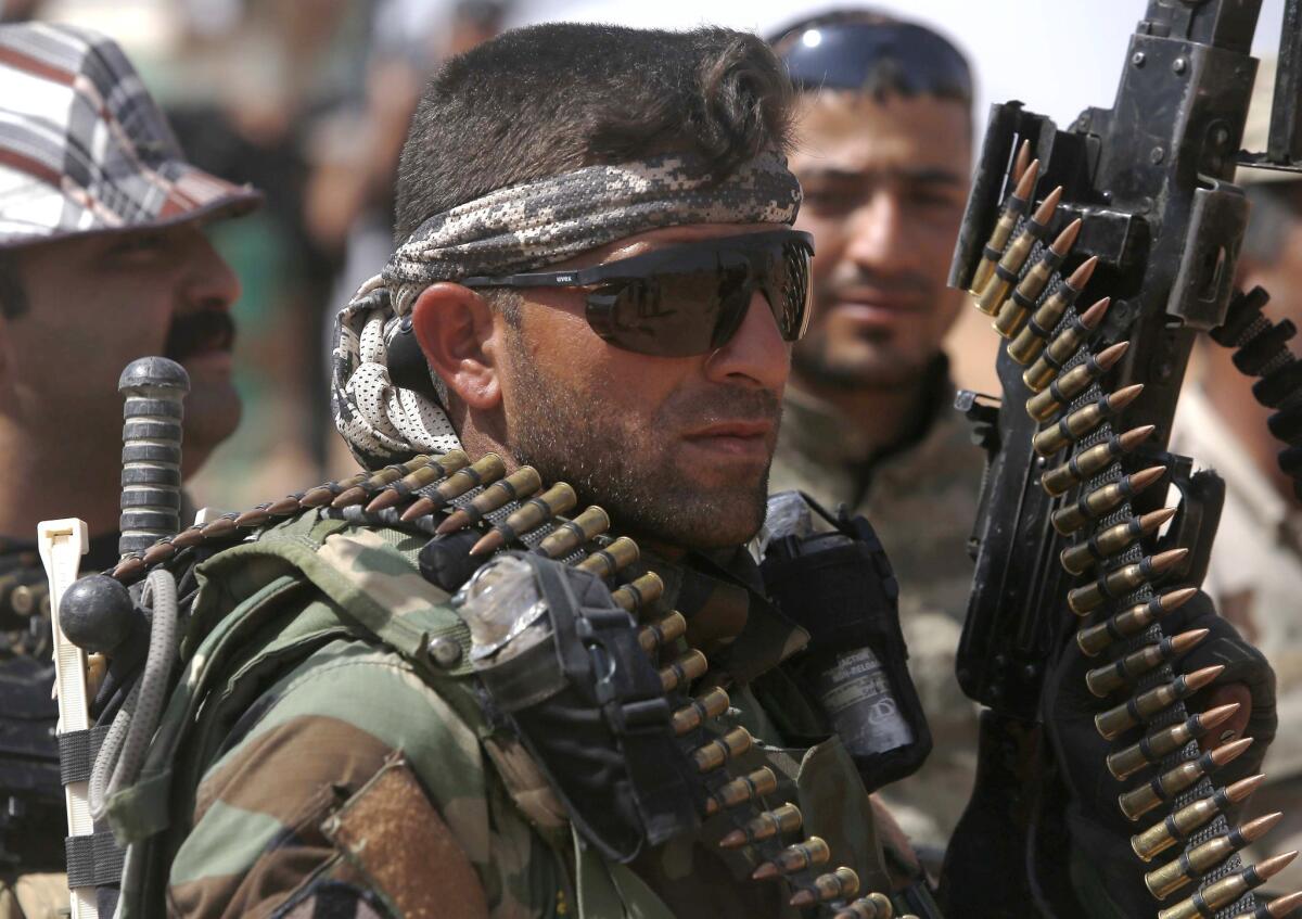 An Iraqi fighter with the Shiite Muslim Al Abbas militia unit near the village of Nukhayb in embattled Anbar province west of Baghdad on May 19.