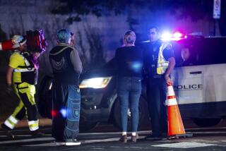 Neighborhood residents speak to Austin Police officers in Austin, Texas late Tuesday, Dec. 5, 2023. Texas authorities say a daylong series of attacks in Austin has left four people dead and at least three injured, and a man believed to be connected to them and the deaths of two people near San Antonio was taken into custody. (Sara Diggins /Austin American-Statesman via AP)