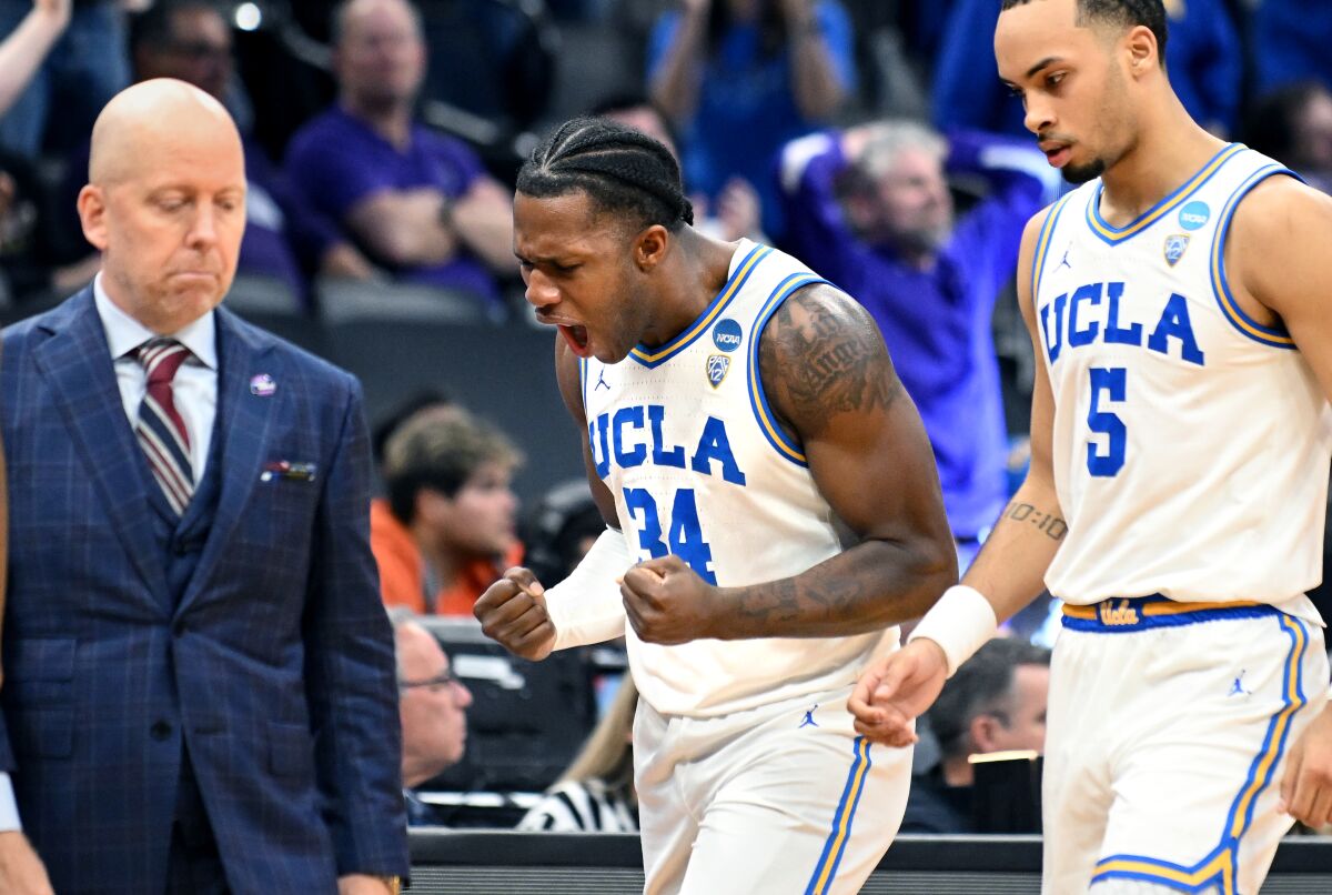UCLA's David Singleton (34) celebrates after making a three-pointer against Northwestern in the second half Saturday.