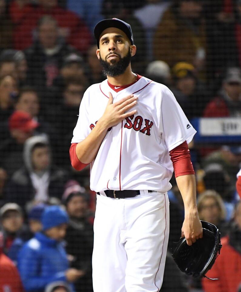 Red Sox pitcher David Price reacts after allowing an RBI single to Dodgers' Yasiel Puig.