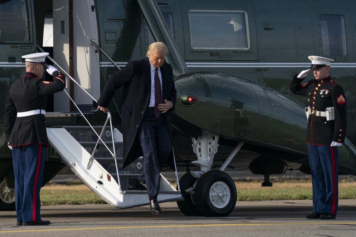 In this Thursday, Oct. 1, 2020, photo President Donald Trump steps off of Marine One at Morristown Municipal Airport in Morristown, N.J., after attending a fundraiser at Trump National Golf Club in Bedminster. (AP Photo/Evan Vucci)