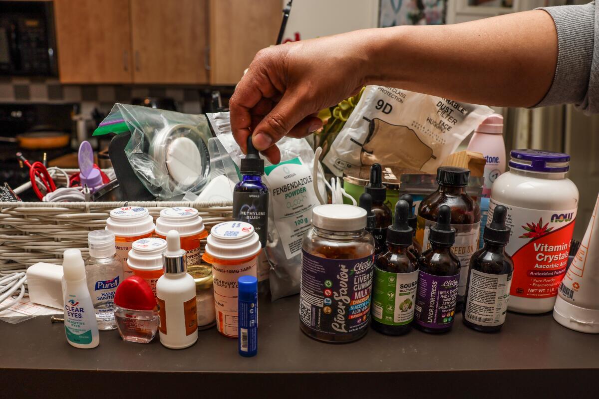 A passel of medications and supplements successful the kitchen.