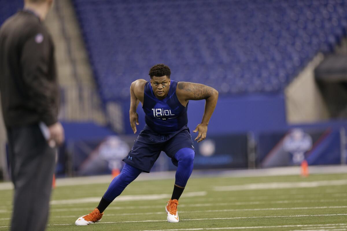 Miami offensive lineman Ereck Flowers runs a drill at the NFL scouting combine in Indianapolis on Feb. 20.