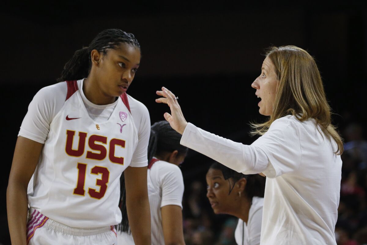 USC women's basketball coach Lindsay Gottlieb speaks with guard Rayah Marshall during a game.