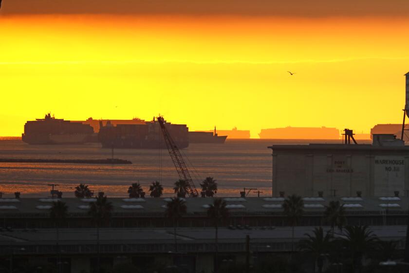 Los Angeles, California-Nov. 15, 2021- Cargo ships are backed up waiting to unload in the Port of Los Angeles And Port of Long Beach on Nov. 17, 2021. (Carolyn Cole / Los Angeles Times)