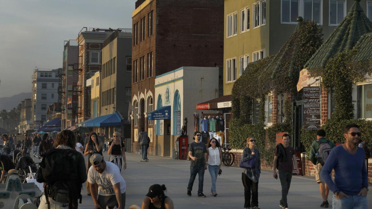The boardwalk in Venice Beach, where property owners complained that a newly formed Business Improvement District failed to promptly provide services it had promised.