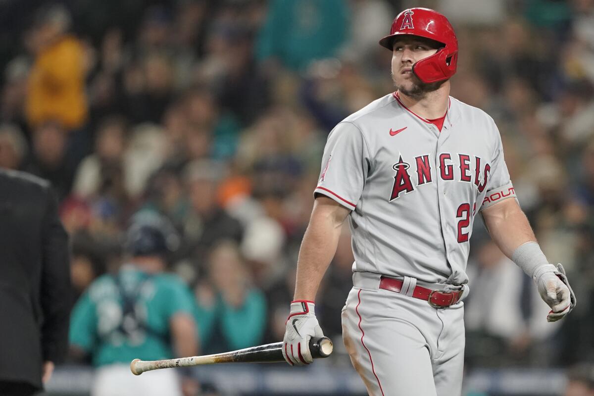 Angels center fielder Mike Trout walks back to the dugout after striking out last week against the Seattle Mariners.