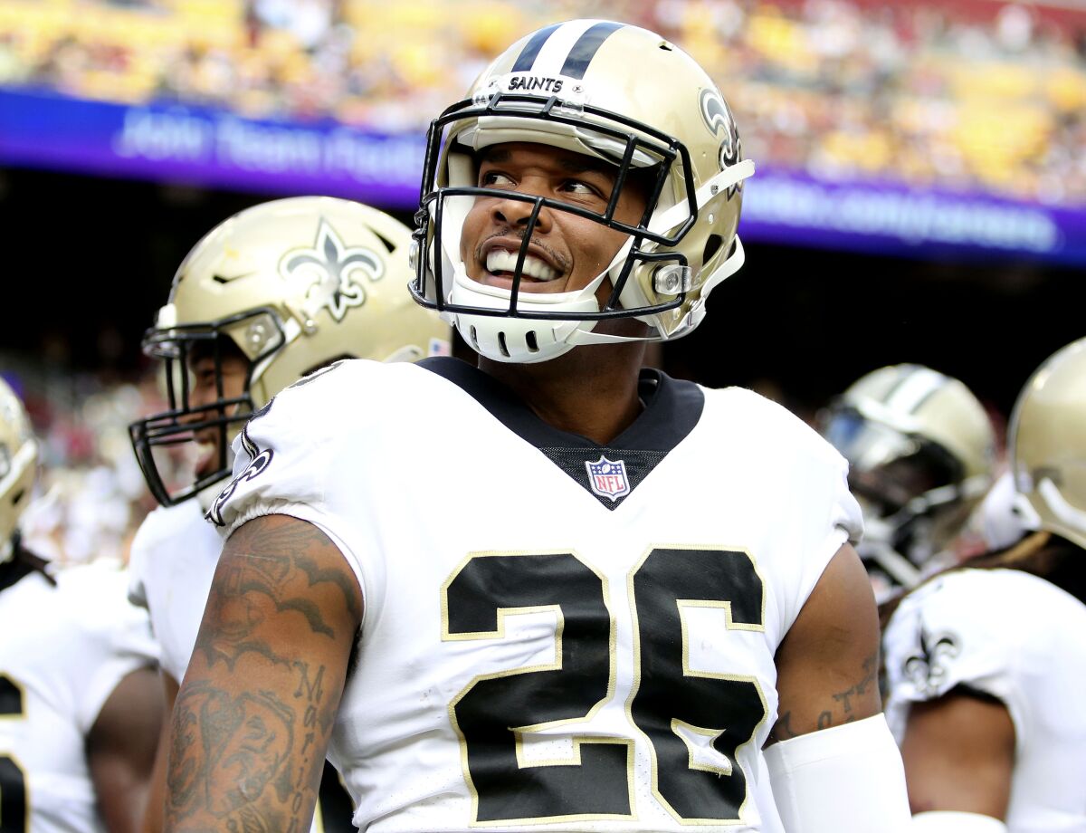 FILE - New Orleans Saints cornerback P.J. Williams (26) smiles during an NFL football game against the Washington Football Team, Oct. 10, 2021, in Landover, Md. A person familiar with the decision says the Saints are bringing back veteran defensive back Williams on a one-year contract. The person spoke to The Associated Press on condition of anonymity on Saturday, April 2, 2022, because the agreement has not been announced. (AP Photo/Daniel Kucin Jr., File)