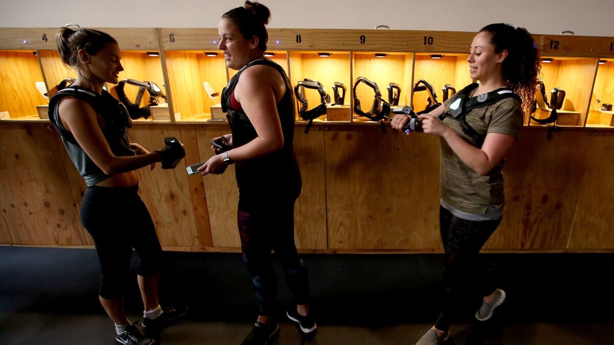 Players suit up for a round of laser tag last month. (Luis Sinco / Los Angeles Times)