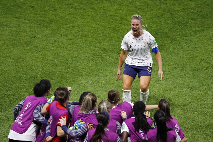 FILE - France's Amandine Henry celebrates with teammates after scoring her side's second goal during the Women's World Cup round of 16 soccer match between France and Brazil at Stade Oceane, in Le Havre, France, Sunday, June 23, 2019. Former France captain Amandine Henry has been called up by coach Herve Renard to prepare for the upcoming Women’s World Cup. Renard chose 26 players who will ultimately be trimmed to 23 for the tournament in Australia and New Zealand next month. (AP Photo/Francois Mori, File)
