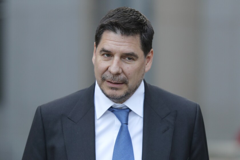 FILE - In this Jan. 15, 2020, file photo, Sprint CEO Marcelo Claure speaks to reporters as he leaves the courthouse in New York. Claure, who joined SoftBank Group after turning around one of its key investments, office-sharing business WeWork, is leaving, the Japanese technology company said Friday, Jan. 28, 2022. (AP Photo/Seth Wenig, File)