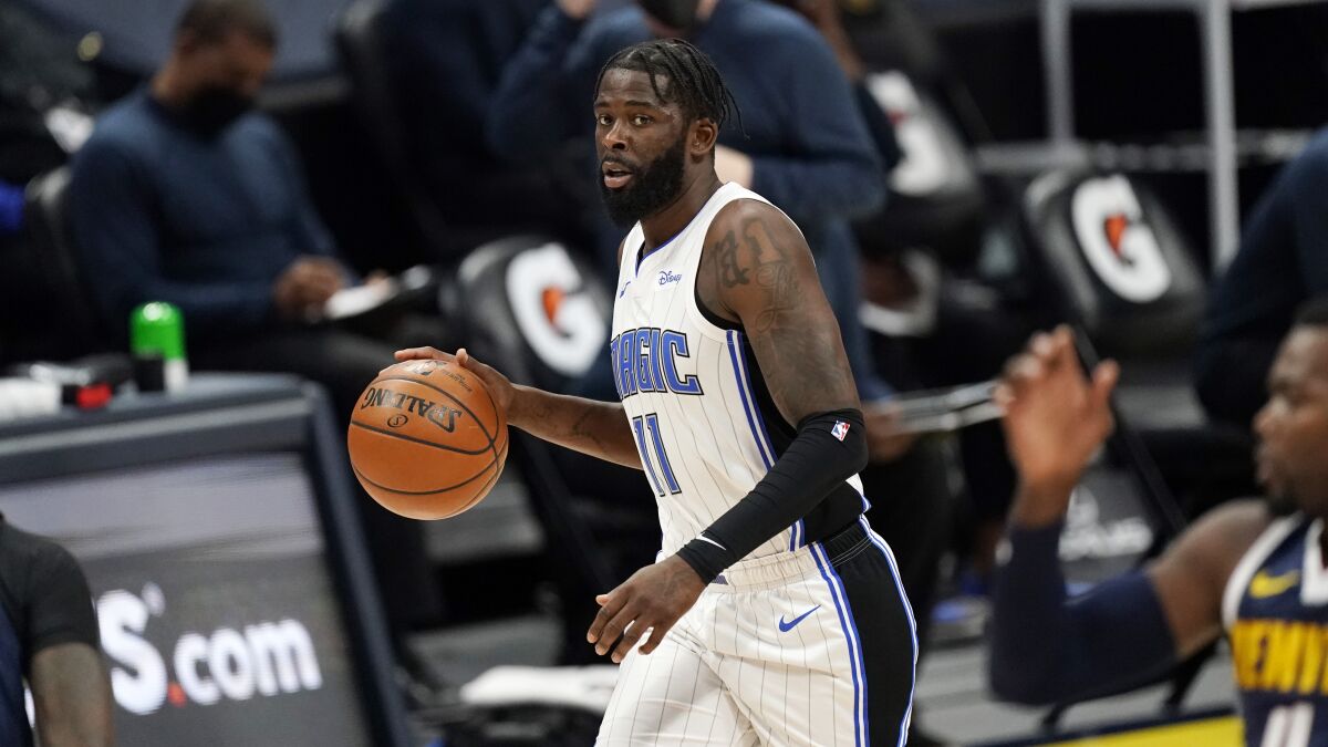 James Ennis III controls the ball during a game between the Orlando Magic and Denver Nuggets in April.