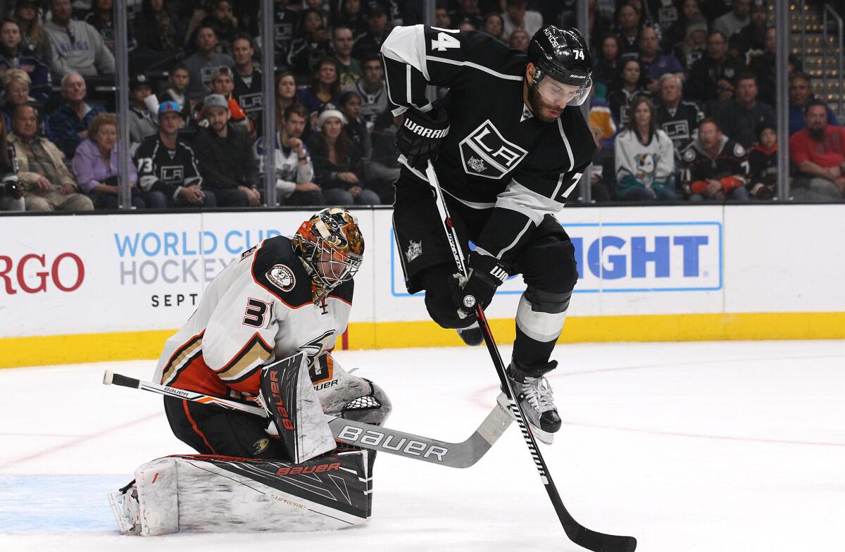 Kings left wing Dwight King tries to get out of the way of a shot on Ducks goalie Frederik Andersen in the first period of a game on Mar. 5.