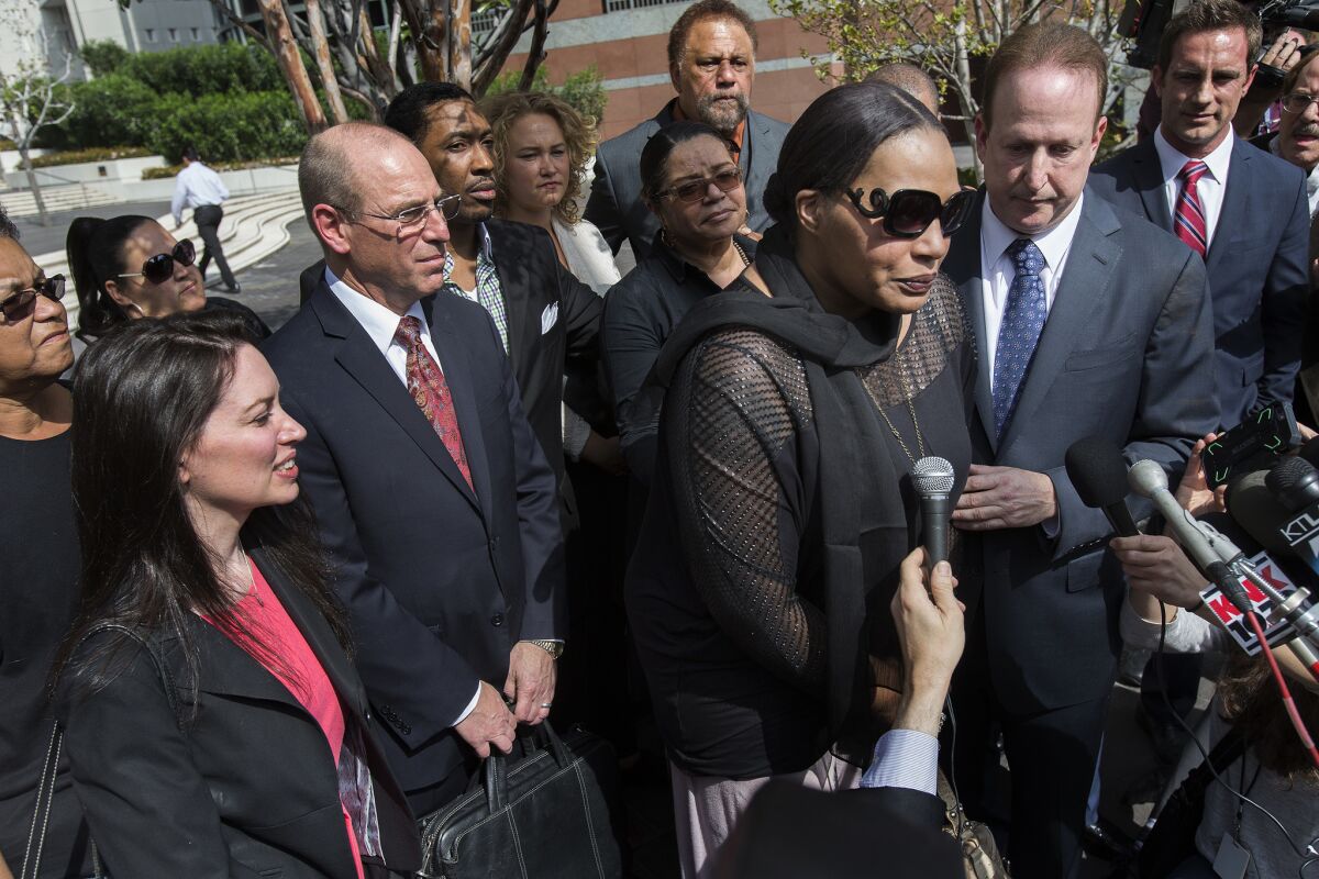 Nona Gaye, daughter of the late Marvin Gaye, with attorney Richard Busch, right, speaks to the media after a jury found Pharrell Williams and Robin Thicke guilty of copyright infringement last week.