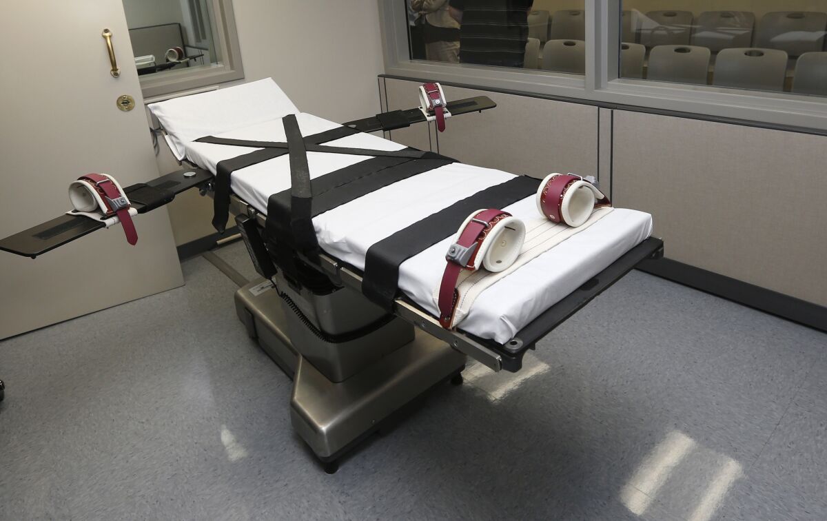 FILE - This Oct. 9, 2014, file photo shows the gurney in the the execution chamber at the Oklahoma State Penitentiary in McAlester, Okla. On Monday, March 7, 2022, attorneys for Oklahoma said the state's three-drug lethal injection method is constitutional and that it's unlikely inmates will experience much pain before they die. (AP Photo/Sue Ogrocki, File)