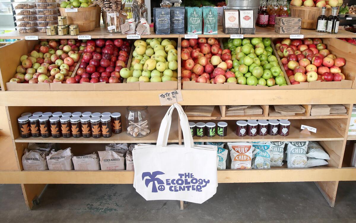 A variety of apples on display at the Farm Stand market at the Ecology Center in San Juan Capistrano.