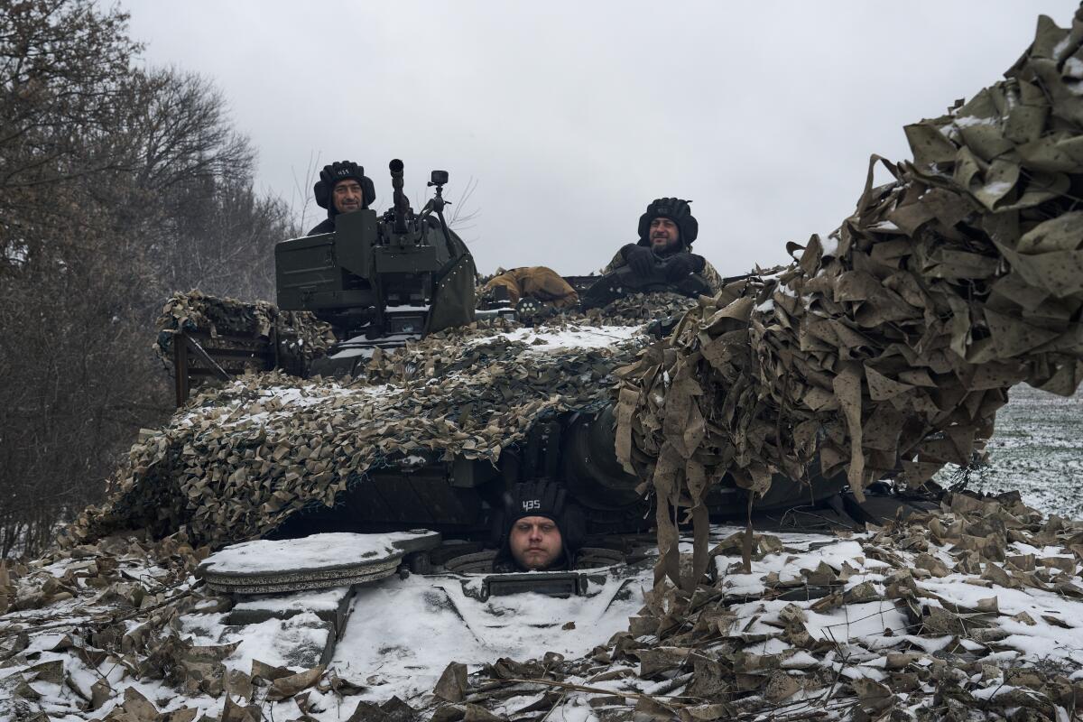 A Ukrainian T-64 tank goes on combat duty in the Bakhmut district on Dec. 8. 