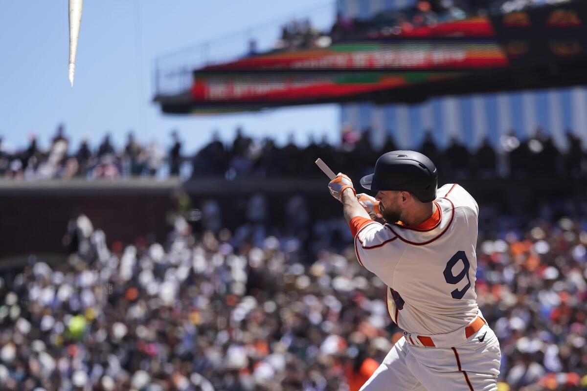 San Francisco Giants' Brandon Belt breaks his bat hitting an RBI single during the second inning of a baseball game against the Milwaukee Brewers in San Francisco, Sunday, July 17, 2022. (AP Photo/Jeff Chiu)