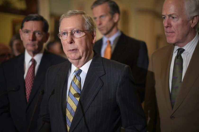 Senate Majority Leader Mitch McConnell talks to reporters Tuesday after a meeting with Republican leaders.