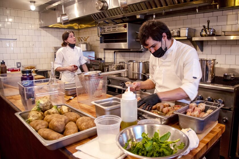 Chef Will Aghajanian preps food before dinner service at Horses restaurant on December 23, 2021