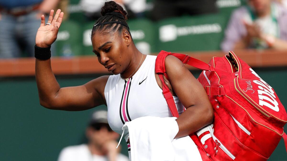 Serena Williams acknowledges the crowd after retiring her match against Garbine Muguruza on Sunday.