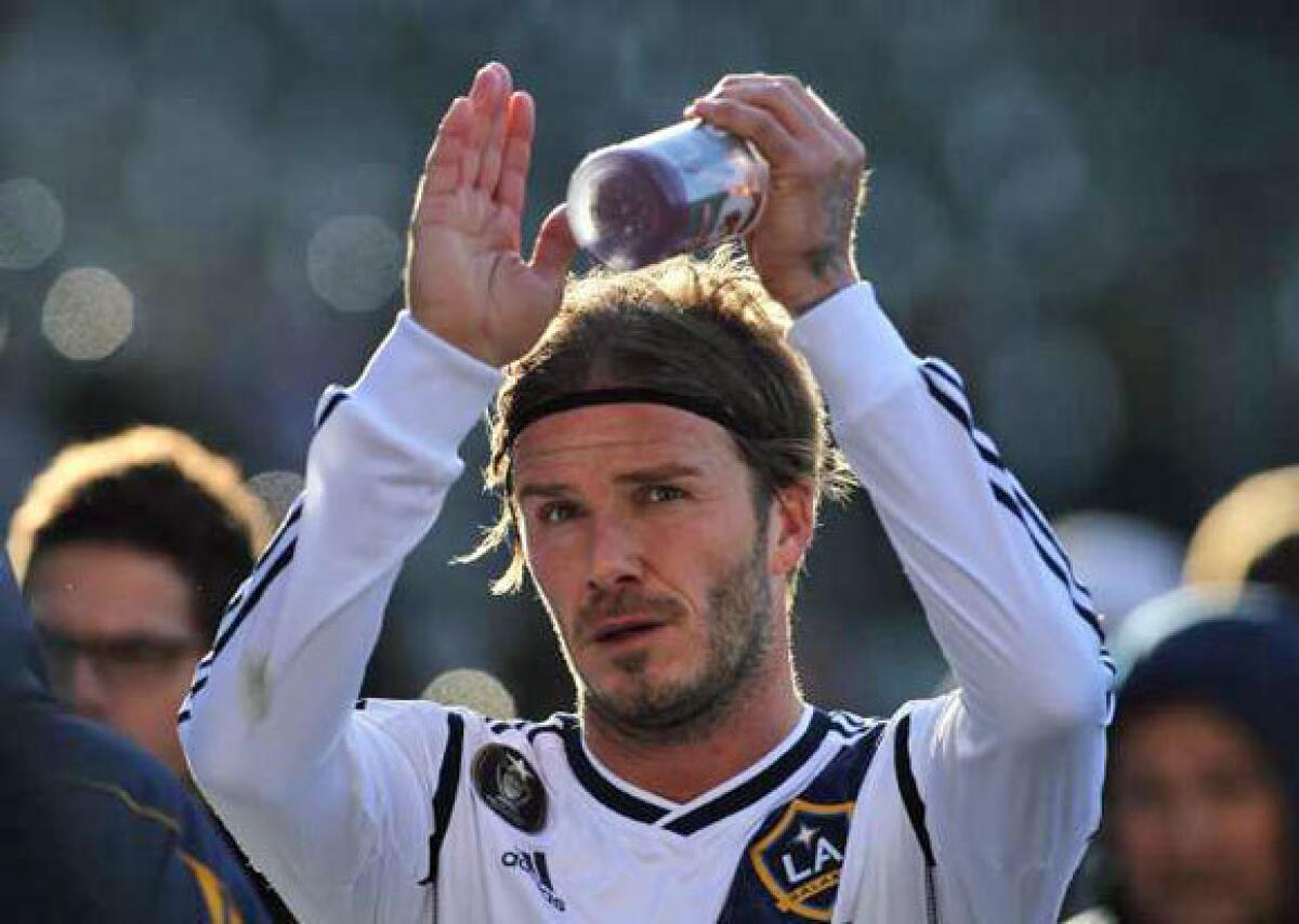 David Beckham applauds the fans after the Galaxy defeated D.C. United, 3-1, at the Home Depot Center on Sunday.