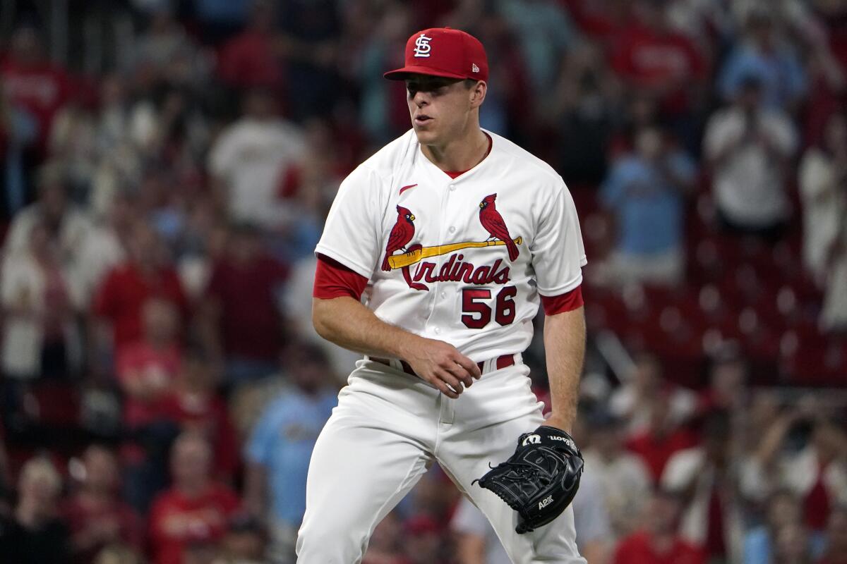 St. Louis Cardinals pitcher Ryan Helsley celebrates after striking out Cincinnati Reds' Aristides Aquino for the final out.