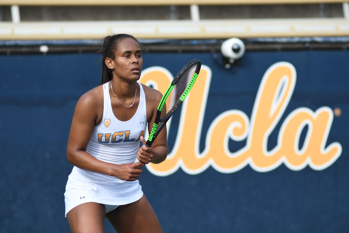UCLA tennis player Abbey Forbes plays during a match.