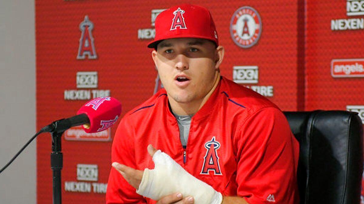 The Angels' Mike Trout speaks about his injured left thumb during a news conference June 3. Trout will miss the All-Star game while rehabilitating a torn thumb ligament.